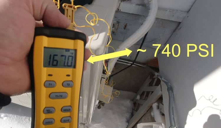 Digital probe reading 167°F refrigerant temperature on a ductless heat pump discharge line during 25°F weather